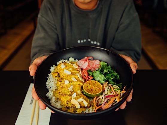 Friends sharing bowls of noodles at wagamama Covent Garden — photo 1